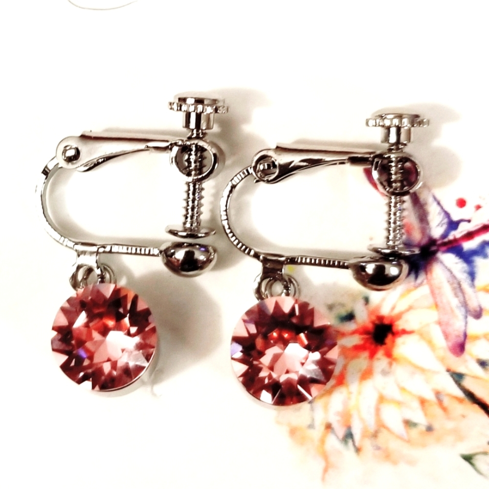 Swarovski 8mm Lt.Amethyst crystal rhodium screwback non-pierced earrings.